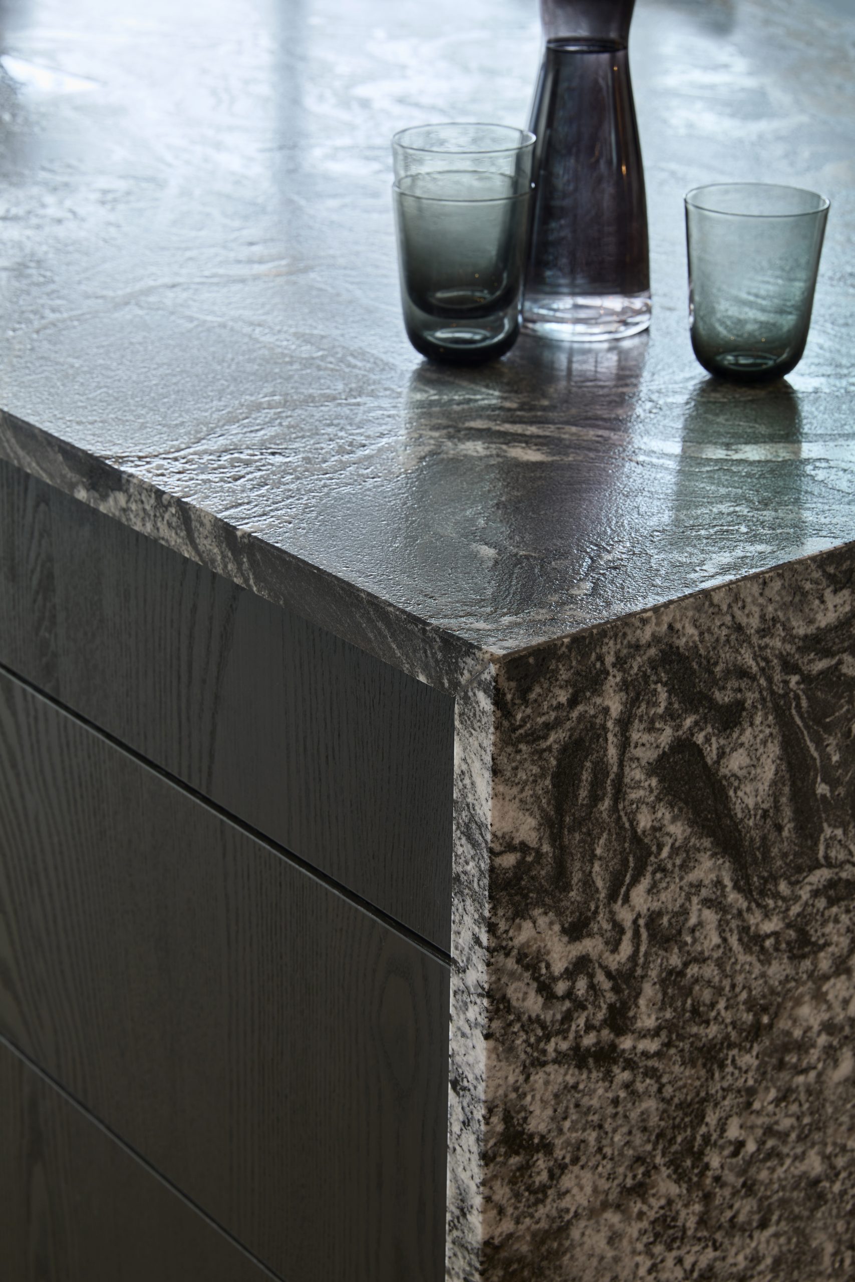 Kitchen detail, close up of waterfall kitchen island in the stunning black beauty granite, heavily veined black and white surface. 