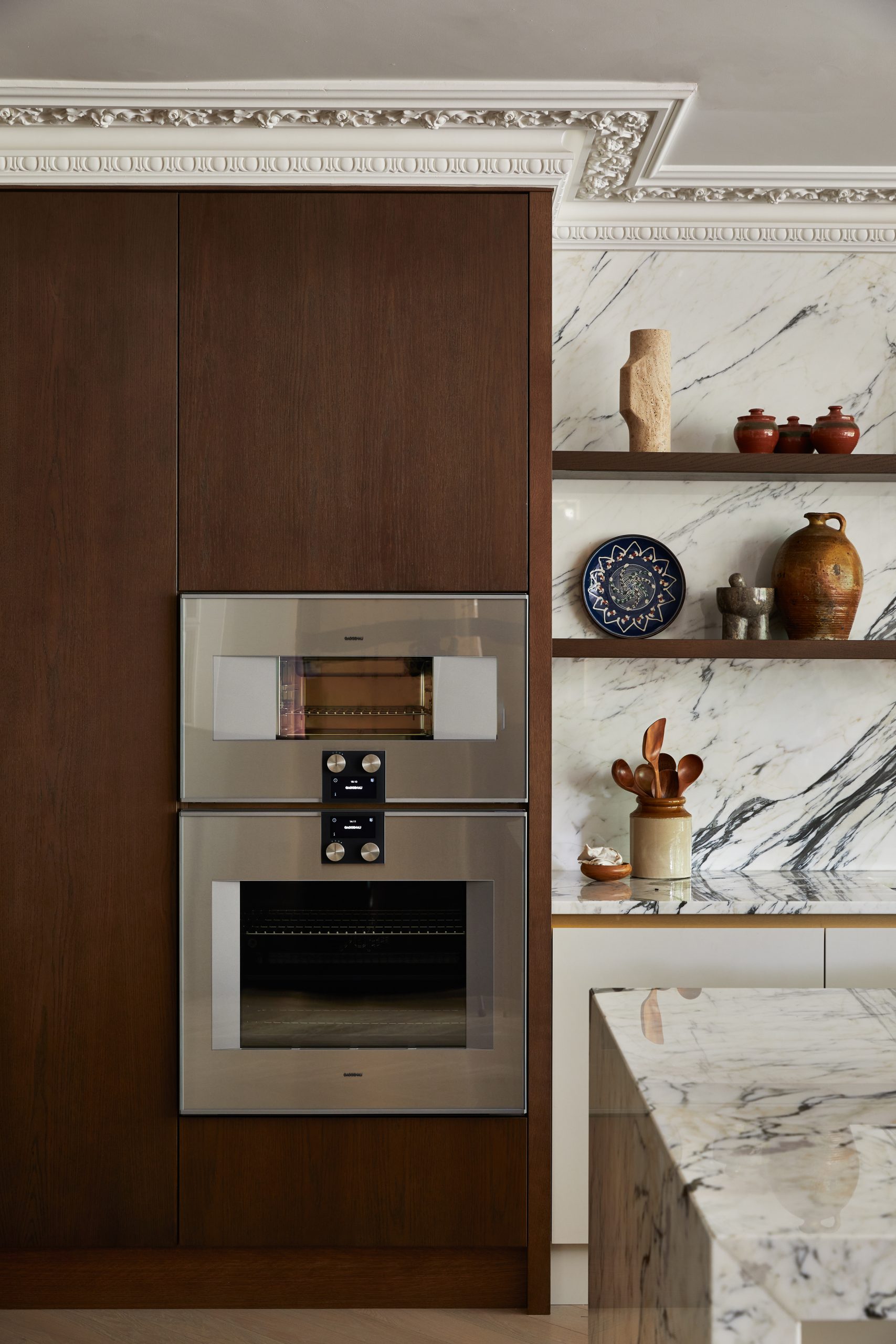 A Gaggenau oven sits flush with the kitchen surface, making a bold statement
